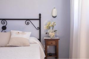 Postel nebo postele na pokoji v ubytování Agriturismo I Tre Fossi