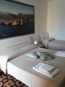 Postel nebo postele na pokoji v ubytování Hotel Rosy