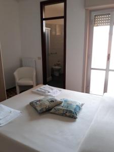 Postel nebo postele na pokoji v ubytování Hotel Rosy