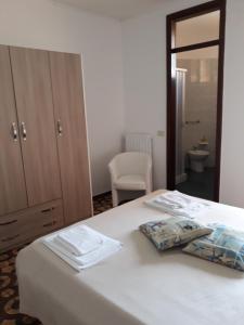 Postel nebo postele na pokoji v ubytování Hotel Rosy