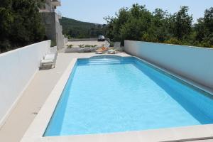a swimming pool on the roof of a house at Golden horizon Cavtat in Cavtat