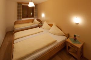 Posteľ alebo postele v izbe v ubytovaní Alpenrelax Krepperhütte