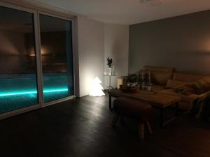 a living room with a couch and a table at Central & Elegant Room in Biel in Biel