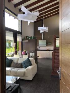 a living room with a white couch and a table at La Casita de Eva in Colunga