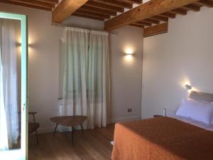 Postel nebo postele na pokoji v ubytování Villa Cicolina