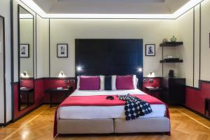 
A bed or beds in a room at 47 Boutique Hotel

