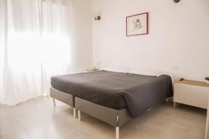 Postel nebo postele na pokoji v ubytování Torre 2 San Bonifacio - Locazione Turistica