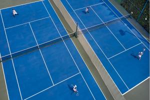 
a tennis court with two tennis racquets on it at Mandarin Oriental Bangkok - SHA Extra Plus in Bangkok
