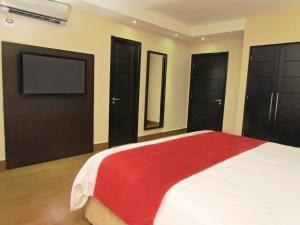 Tempat tidur dalam kamar di Hotel Principe
