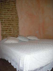 Кровать или кровати в номере Il Castello Di Dante