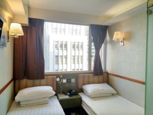 A bed or beds in a room at Celltronik Hostel 先創旅店
