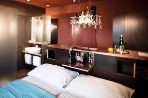 Posteľ alebo postele v izbe v ubytovaní Weingartenhotel Harkamp Südsteiermark