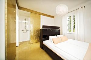 Posteľ alebo postele v izbe v ubytovaní Weingartenhotel Harkamp Südsteiermark