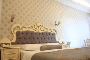 Postel nebo postele na pokoji v ubytování Nayla Palace Hotel-Special Category