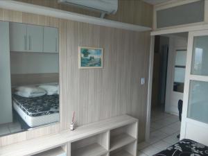 Ένα ή περισσότερα κρεβάτια σε δωμάτιο στο Apartamento 308, Marina, Centro - Torres - RS