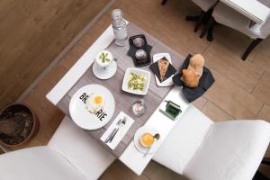 an overhead view of a table with breakfast food on it at Villa Alba Boutique Hotel in Pescara