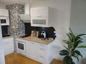 
A kitchen or kitchenette at Tower Apartment
