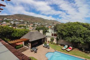 an aerial view of a house with a swimming pool at A Tuscan Villa Guest House in Fish hoek