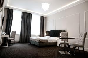 Ένα ή περισσότερα κρεβάτια σε δωμάτιο στο Aparthotel Platinum Apartamenty +53 φωτογραφίες
