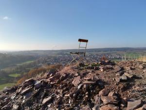 a chair sitting on top of a rocky mountain at Gasthaus Dörsthof in Alzenau