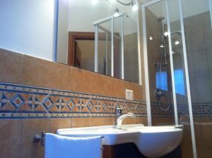 a bathroom with a sink and a mirror at Residenza Guarna in Salerno