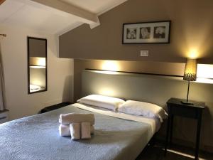 En eller flere senger på et rom på Hotel Casale dei Massimi