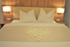 Letto o letti in una camera di Hotel Mauernböck
