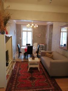 a living room with a couch and a table at Appartement St Martin du Canigou in Casteil