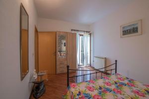 Postel nebo postele na pokoji v ubytování Apartmani Mirjana Umag