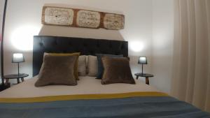 Posteľ alebo postele v izbe v ubytovaní La Maison ai Quattro Canti