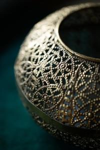 a close up of a silver vase with beads on it at Hofgut Holzmuhle in Germersheim +30 photos