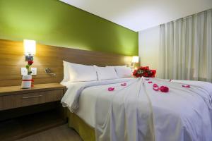 Ένα ή περισσότερα κρεβάτια σε δωμάτιο στο Radisson Hotel Belém