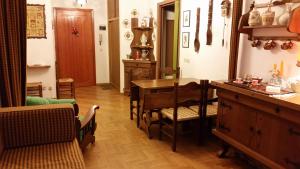 a dining room with a wooden table and chairs at Casa Bruno in Roccaraso, sentirsi a casa propria in Roccaraso