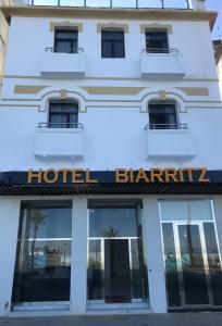 a hotel blantyre building with a hotel sign at Hotel Biarritz in Tangier
