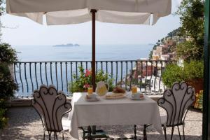 a table that has a table cloth on it at Villa Rosa in Positano