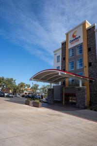 a store front with awning in front of a building at Comfort Suites Cedar Park - Austin Northwest in Cedar Park