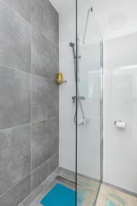 a bathroom with a shower with a glass door at Aldo apartment in Split