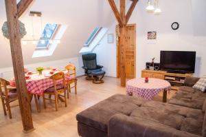 a living room with a couch and a table at Neulandhof Spöring in Walsrode