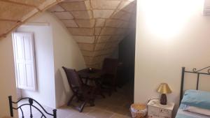 Postel nebo postele na pokoji v ubytování Palazzo Mellacqua