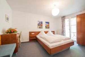 En eller flere senge i et værelse på Ferienwohnungen zum Nachtwächter