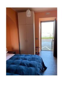 Postel nebo postele na pokoji v ubytování Alloggio Turistico 103