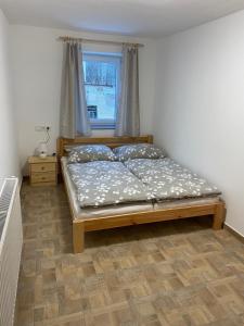 Postel nebo postele na pokoji v ubytování Apartmány Míra