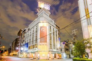 a building with a clock tower on the side of a street at Osaka - Hotel / Vacation STAY 70127 in Osaka