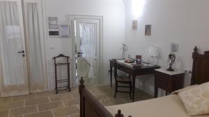 Postel nebo postele na pokoji v ubytování Palazzo Mellacqua