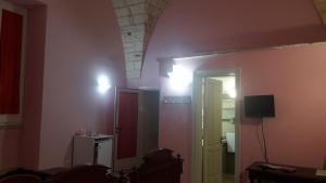 TV a/nebo společenská místnost v ubytování Palazzo Mellacqua