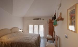 A bed or beds in a room at Maestrale 2