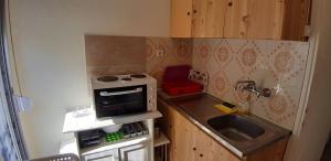 A kitchen or kitchenette at Zoi Apartments