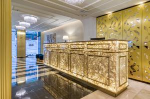 a lobby with a gold altar in a building at Hotel Borges Chiado in Lisbon