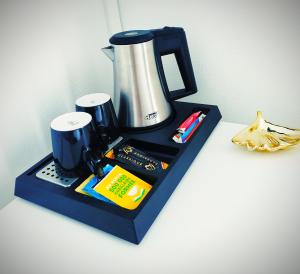 a black tray with a coffee maker on a counter at Colmar Suites - Chez Axelle in Colmar