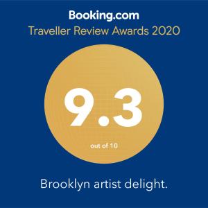 a yellow circle with the number nine and the text travelling review awards at Brooklyn Artist Delight in Brooklyn